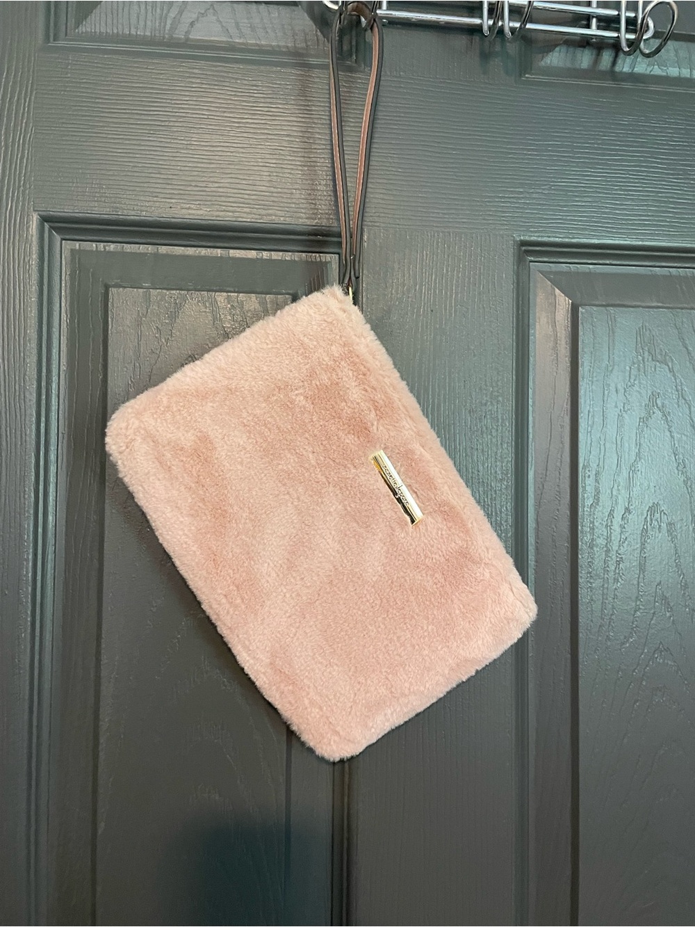 Pink fuzzy wristlet